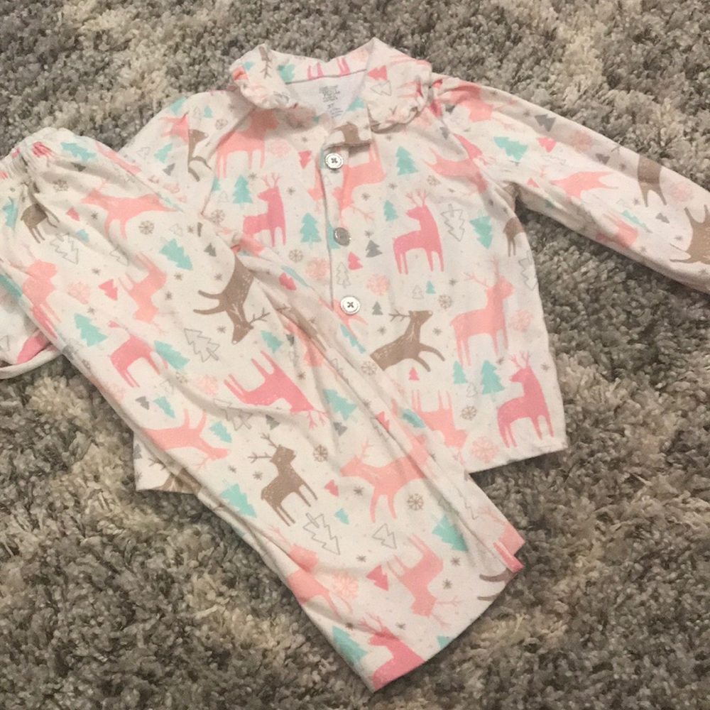 2 pjs one is red and other with rain deer